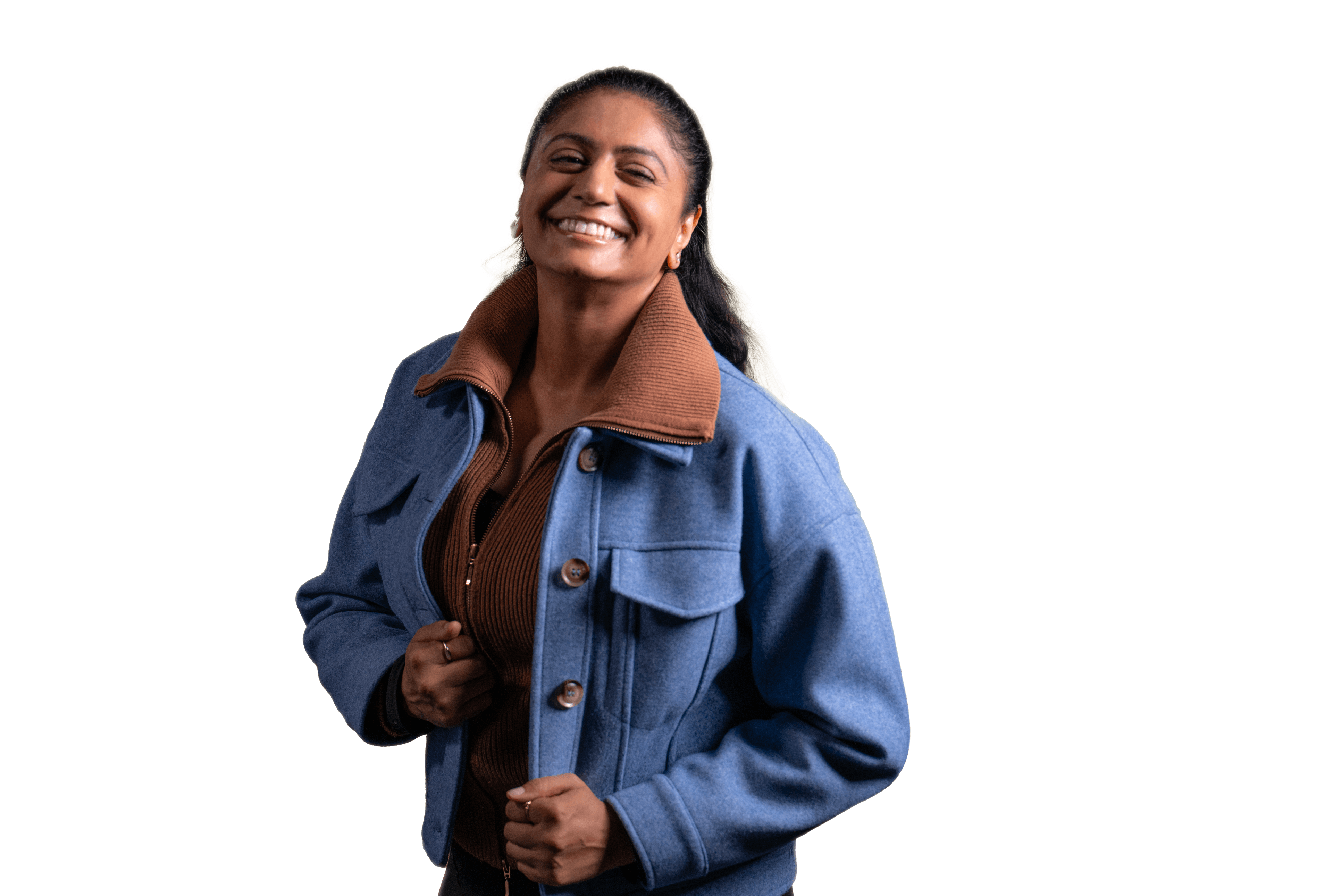 a woman wearing a blue jacket and brown collar is smiling